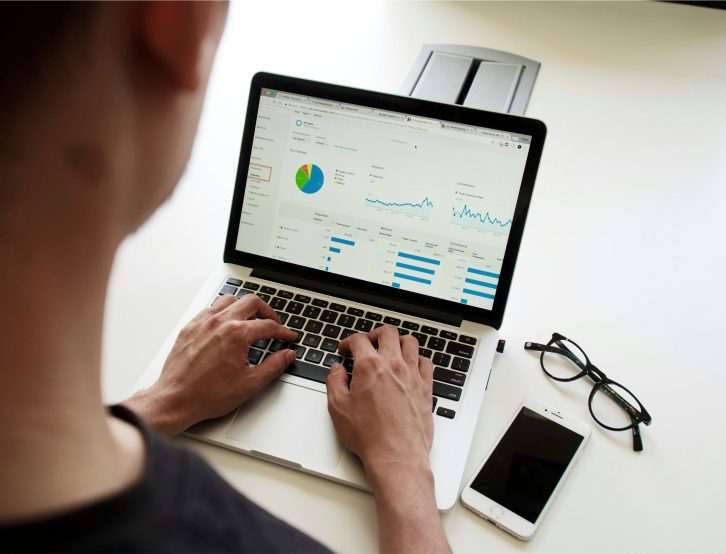 A team conducting a digital transformation audit, analyzing systems for automation opportunities.