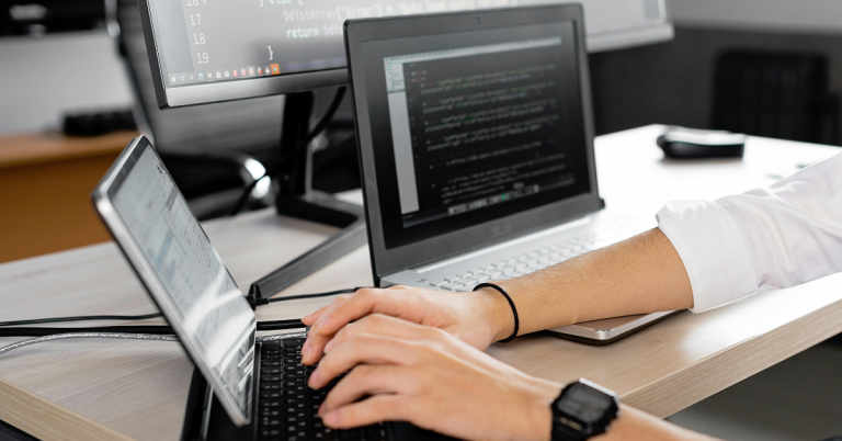 Professional analyzing data on modern digital interface as part of legacy software modernization process.
